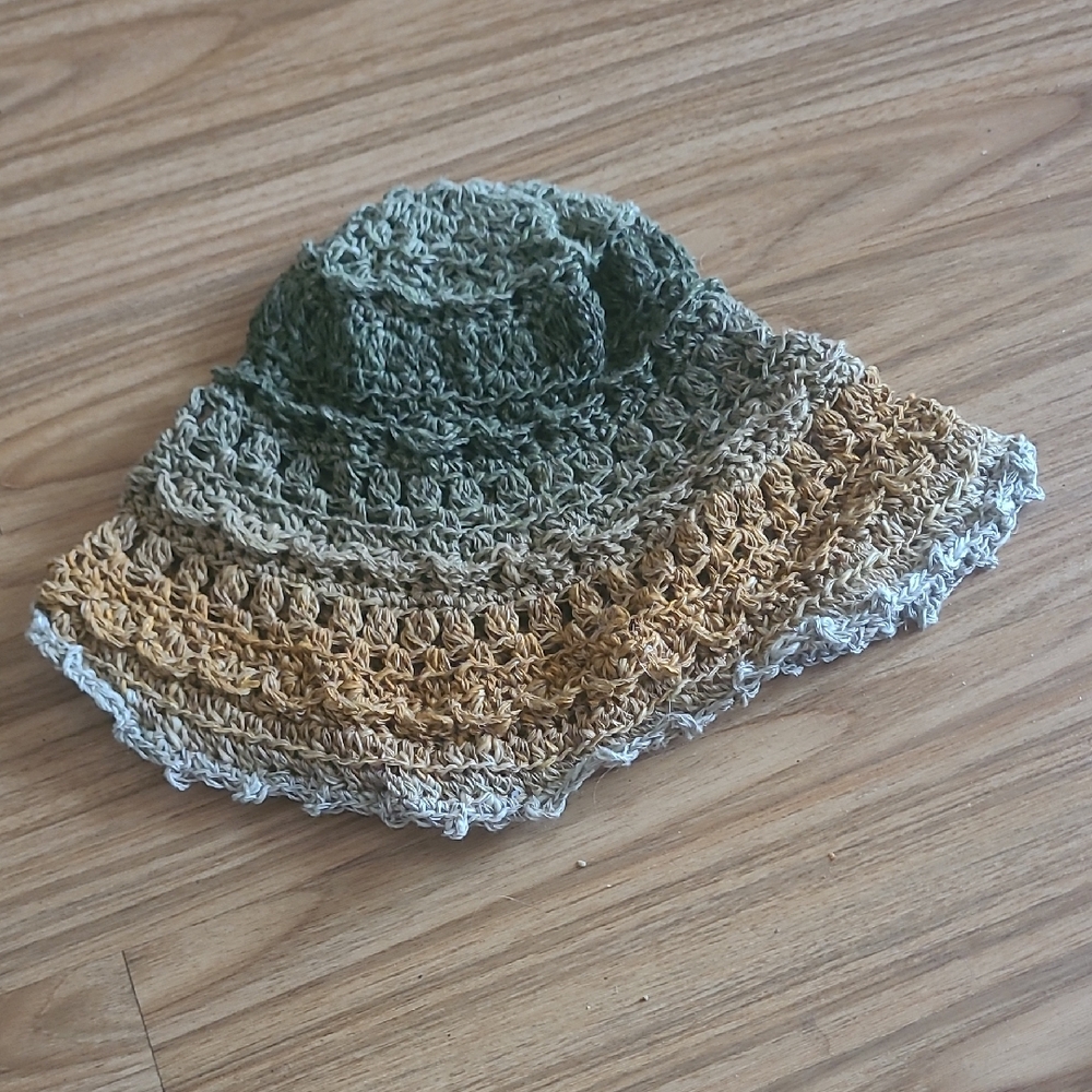 Green and Brown Crochet Hat with Intricate Patterns